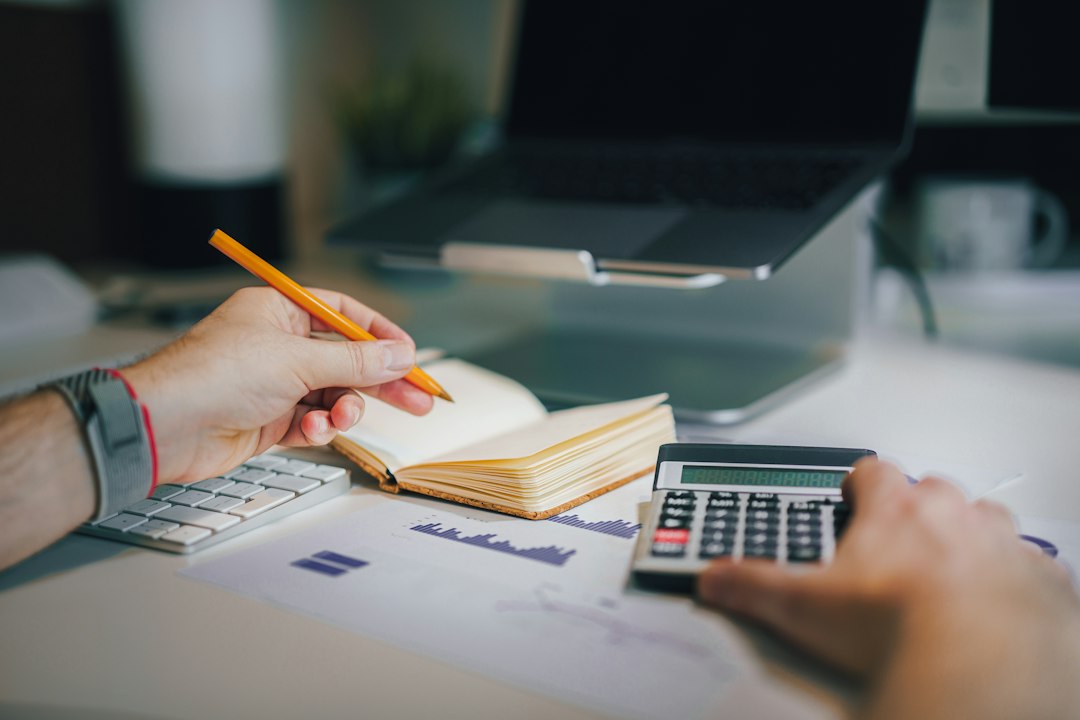 Freelancer reviewing freelance pricing and GST figures with an accountant